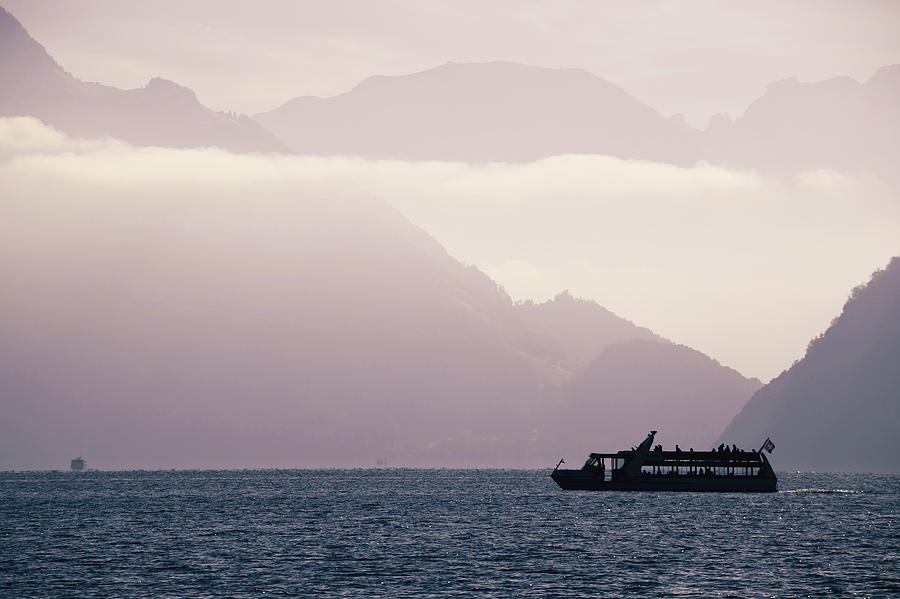 Boat on Swiss alke Luzern with mountain cliffs background silhou Photograph by Brch Photography