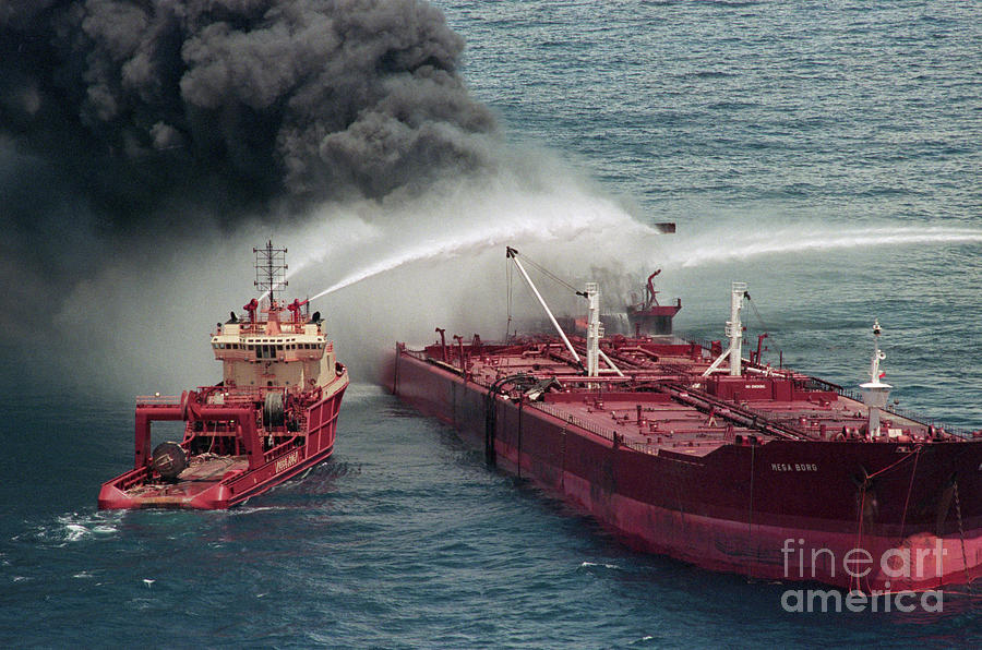 Boat Pours Water On Burning Oil Tanker Photograph by Bettmann