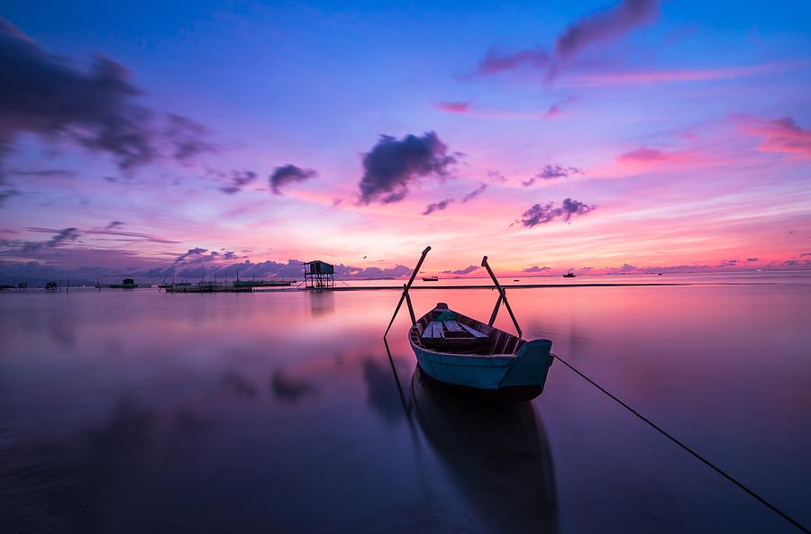 Boat under the sunset Photograph by Top Wallpapers