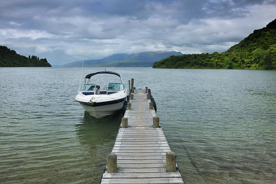 Boat With Wooden Jetty Photograph by Raimund Linke