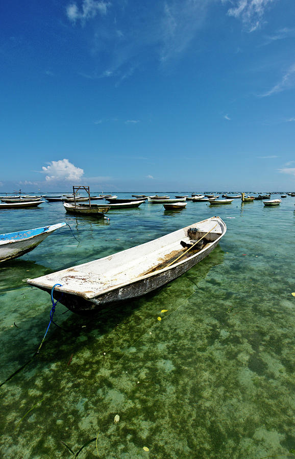 Boats In Shallow Bay With Blue Sky Photograph by James Morgan