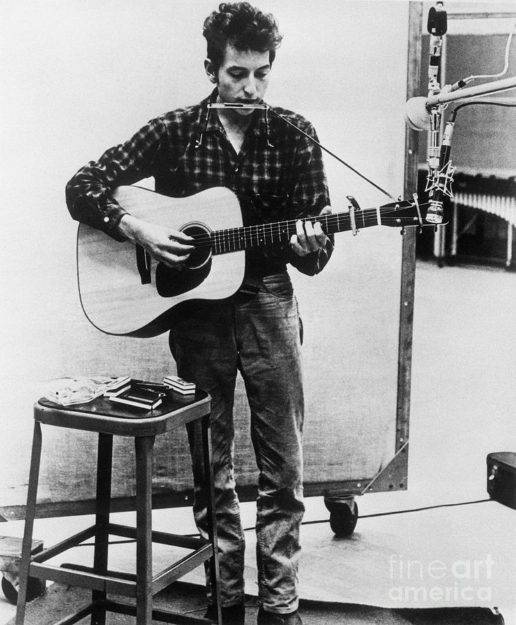 Bob Dylan Playing Harmonica And Guitar Photograph by Bettmann