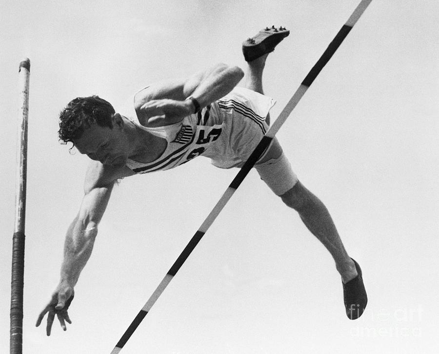 Bob Richards Going Over Pole Vault Photograph by Bettmann