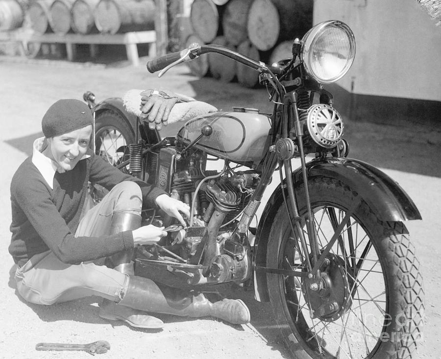 Bobby Trout Repairing Motorcycle Photograph by Bettmann
