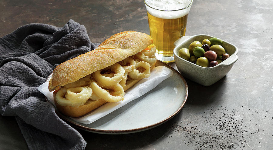 Bocadillo Con Calamares Or Squid Sandwich With Beer, Very Popular In Madrid Spanish Typical Tapas Photograph by Julia Bogdanova