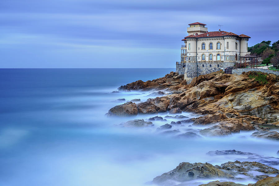 Boccale castle landmark on cliff rock and sea. Tuscany, Italy. Long exposure photography. Photograph by Stefano Orazzini