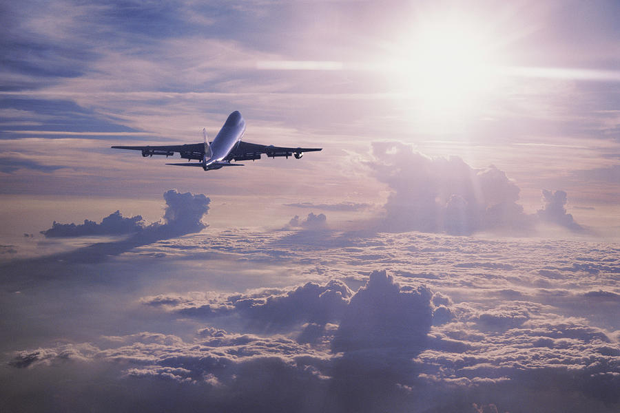 Boeing 747 Jet Plane Flying Over Clouds By Jeff Hunter