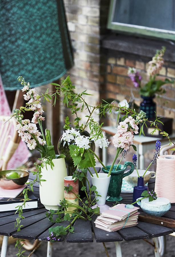 Bohemian-style Flower Arrangements In Various Vases On Table Photograph by Nicoline Olsen