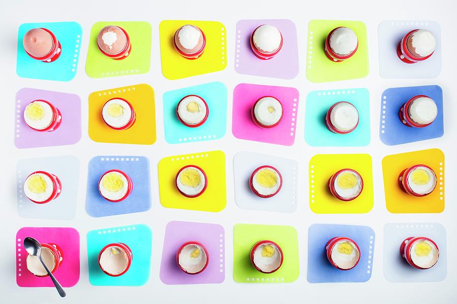 Boiled Eggs In Egg Cups On Coloured Coasters seen From Above Photograph by Jan Prerovsky
