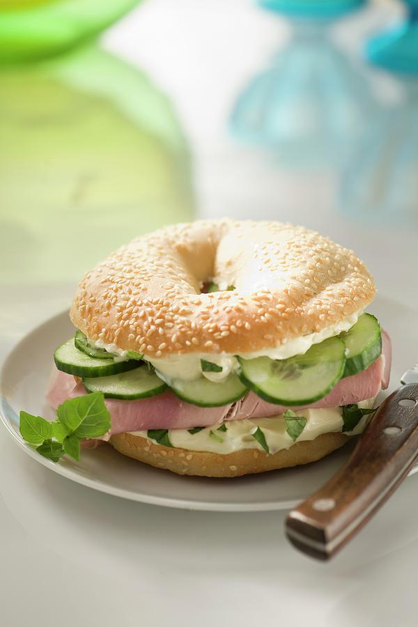 Boiled Ham And Cucumber Bagel Sandwich Photograph by Berru