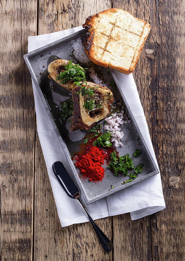 Bone Marrow With Onion And Hearbs Photograph by Vulman Pter