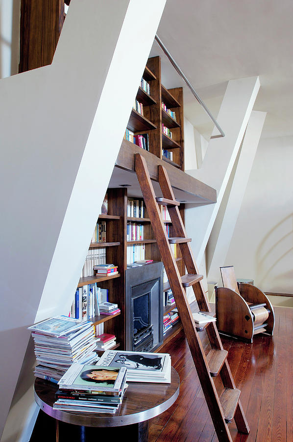 Bookcase With Library Ladder And Fireplace In High-ceilinged Room Photograph by Henri Del Olmo