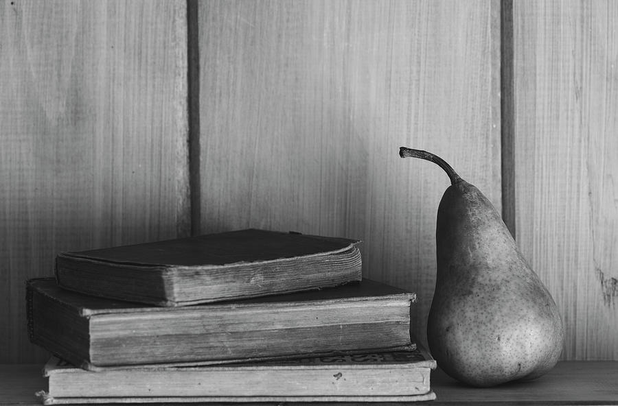 Books and Pear Black and White Photograph by Andrew Pacheco