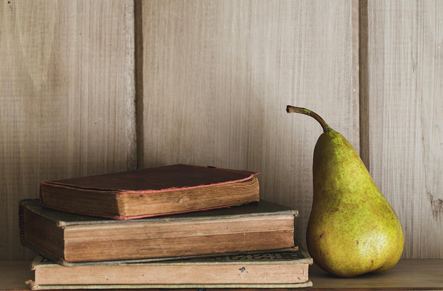 Books and Pear Full Color Photograph by Andrew Pacheco