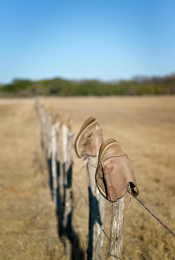 Boots On Fence Photograph by Austinartist