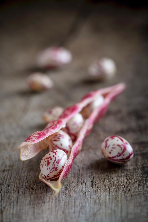 Borlotti Beans On A Wooden Surface close-up Photograph by Nitin Kapoor