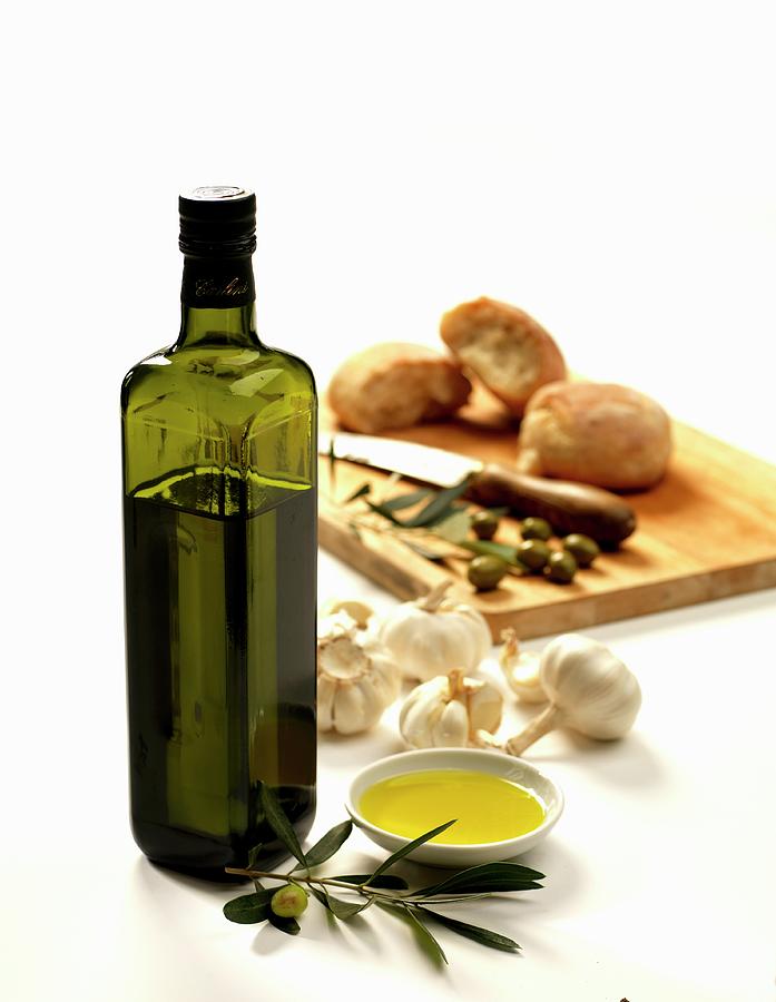Bottle Of Olive Oil With Garlic Olives And Bread Photograph by Robert Morris