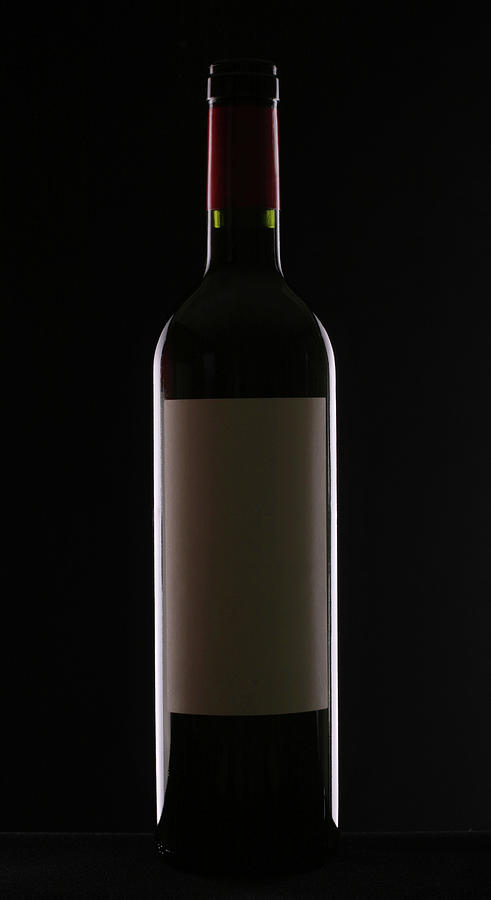 Bottle Of Red Wine On Black Background Photograph by Donald gruener