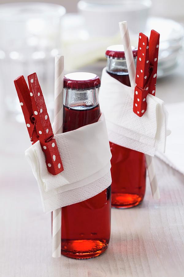 Bottled Drinks Decorated With Napkins & Painted Clothes Pegs Photograph by Franziska Taube