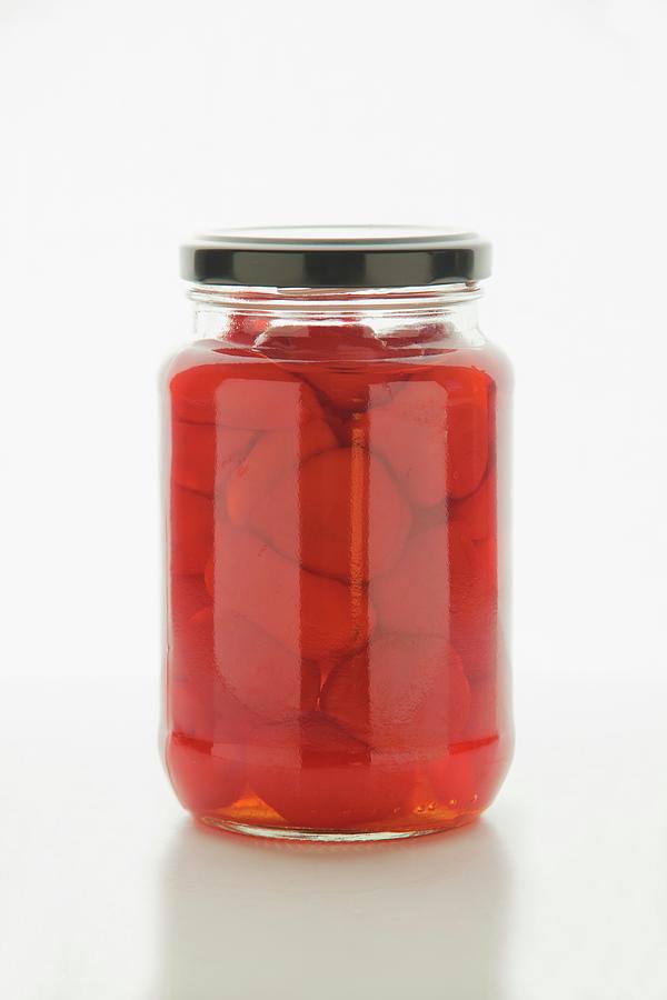Bottled Peppers In Jar Photograph by William Boch