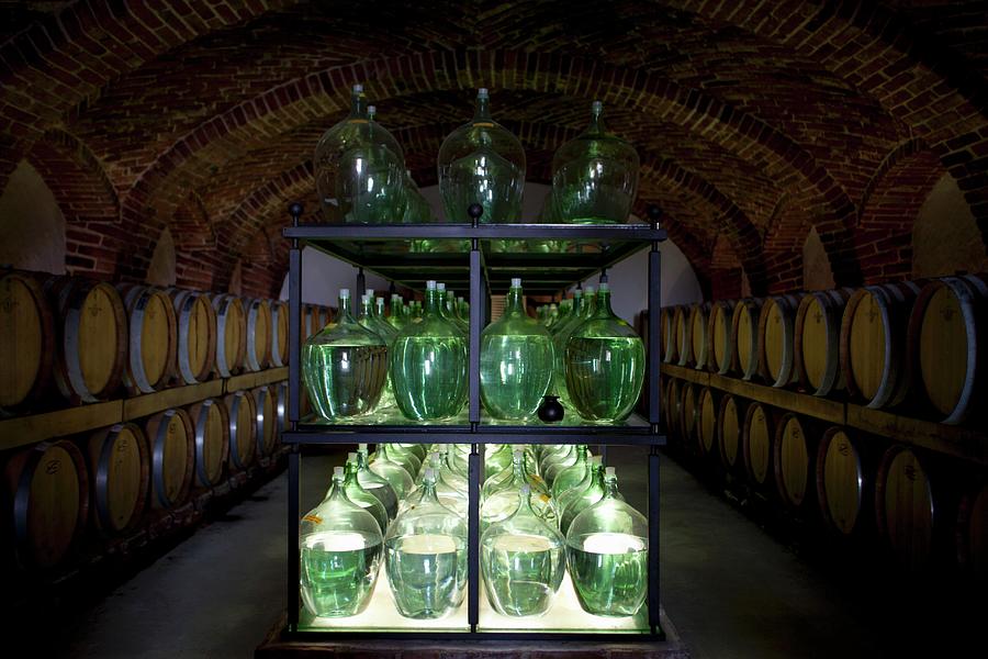 Bottles And Barrels Of Vinegar In A Cellar Photograph by Joerg Lehmann
