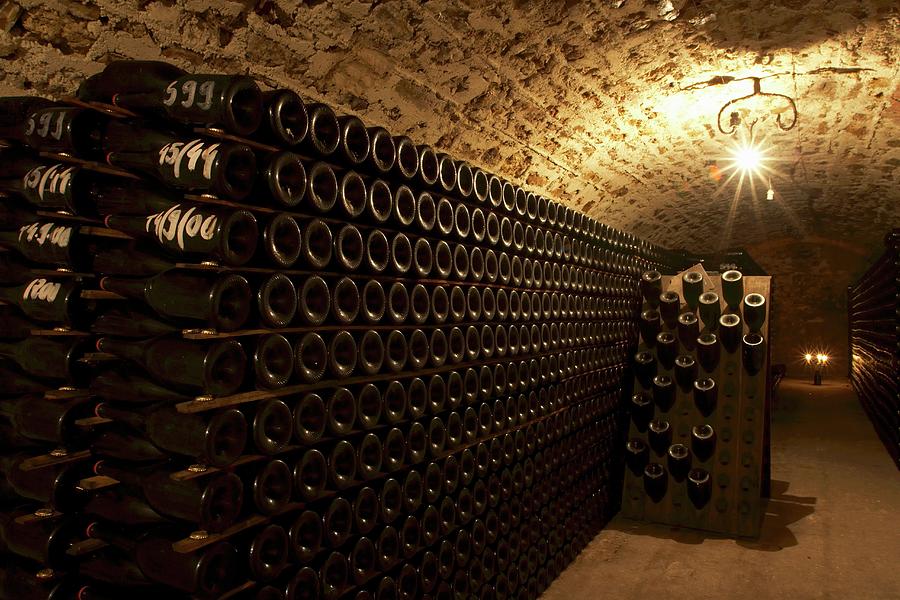 Bottles Of Wine In A Cellar Photograph by Ramen