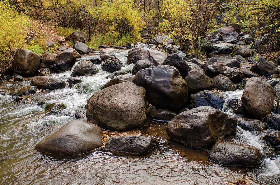 Boulders in Creek Photograph by Jeff Phillippi