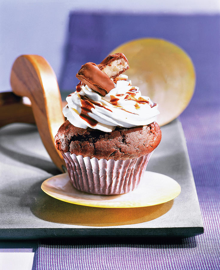 Bounty Muffin With Icing On Small Serving Dish Photograph by Jalag ...