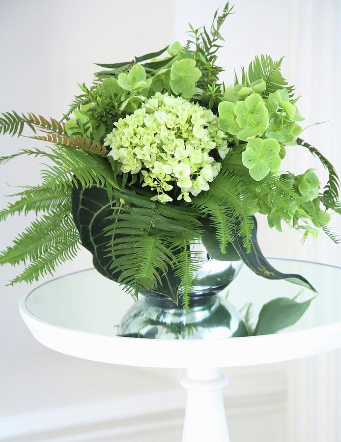 Bouquet Of Ferns And Hydrangeas On Glass Table Photograph by Steven Morris