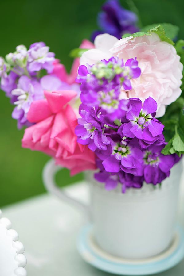 Bouquet Of Summer Flowers Decorating Buffet Table close-up Photograph by Winfried Heinze