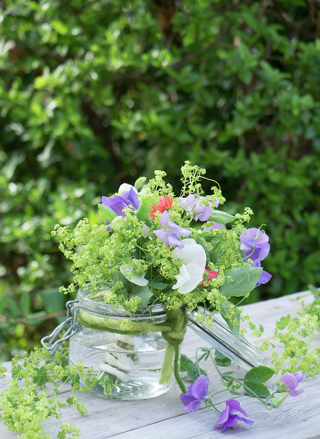 Bouquet Of Sweet Peas And Ladys Mantle In A Mason Jar Photograph by Martina Schindler