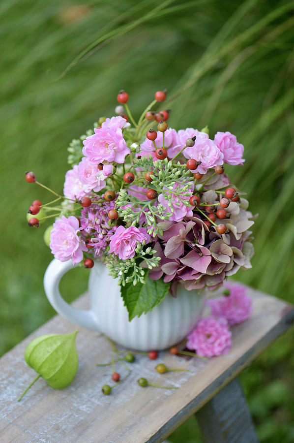 Bouquet With Rose Hips, Hydrangea, Sedum And Roses Photograph by Daniela Behr