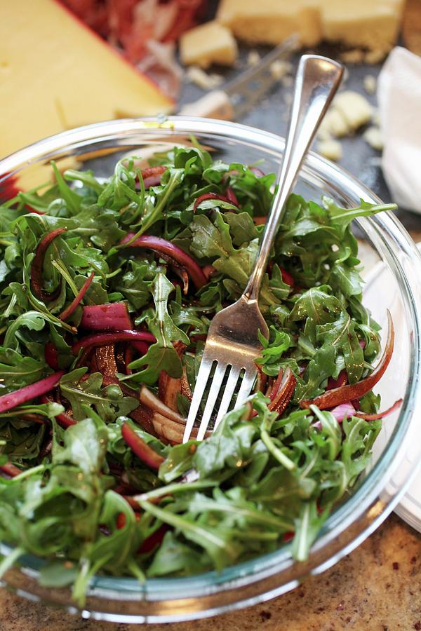 Bowl Of Arugula Salad With Balsamic Marinated Red Onions Photograph by Doug Schneider Photography