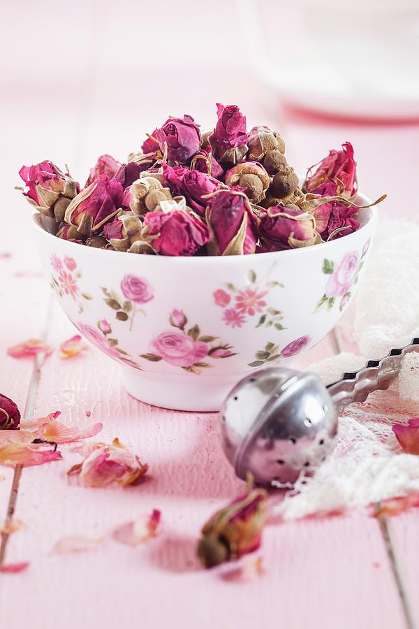 Bowl Of Dried Moroccan Rosebuds And Tea Infuser For Making Rose Tea Photograph by Susan Brooks-dammann