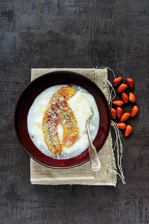 Bowl Of Greek Yogurt With Grilled Banana, Coconut And Maple Syrup Photograph by Yuliya Gontar