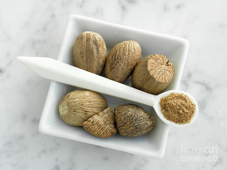 Bowl Of Nutmeg And Spoonful Of Nutmeg Powder Photograph By Maximilian