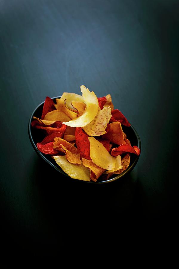 Bowl Of Vegetable Crisps Photograph by Lorthios
