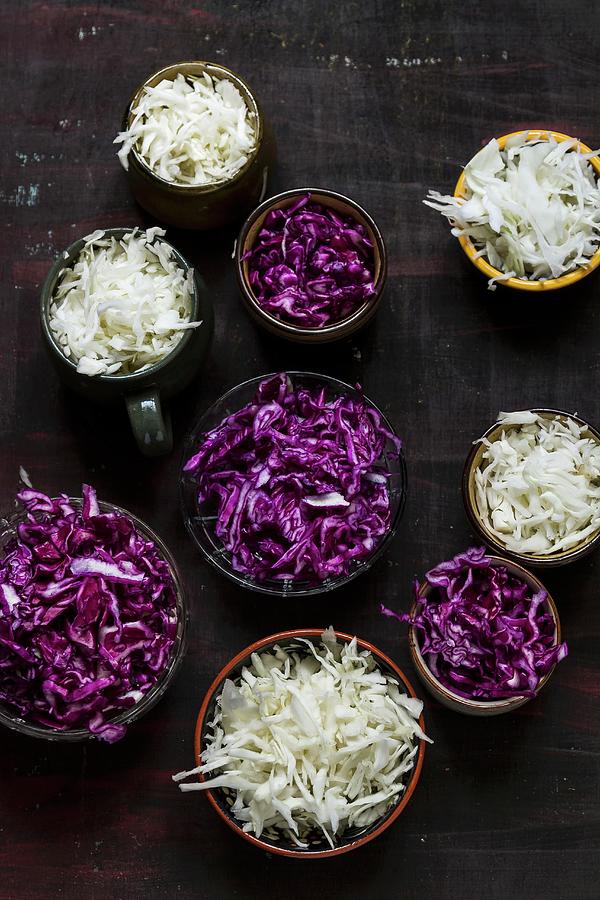 Bowls Of Sliced Red And White Cabbage Photograph by Adel Bekefi