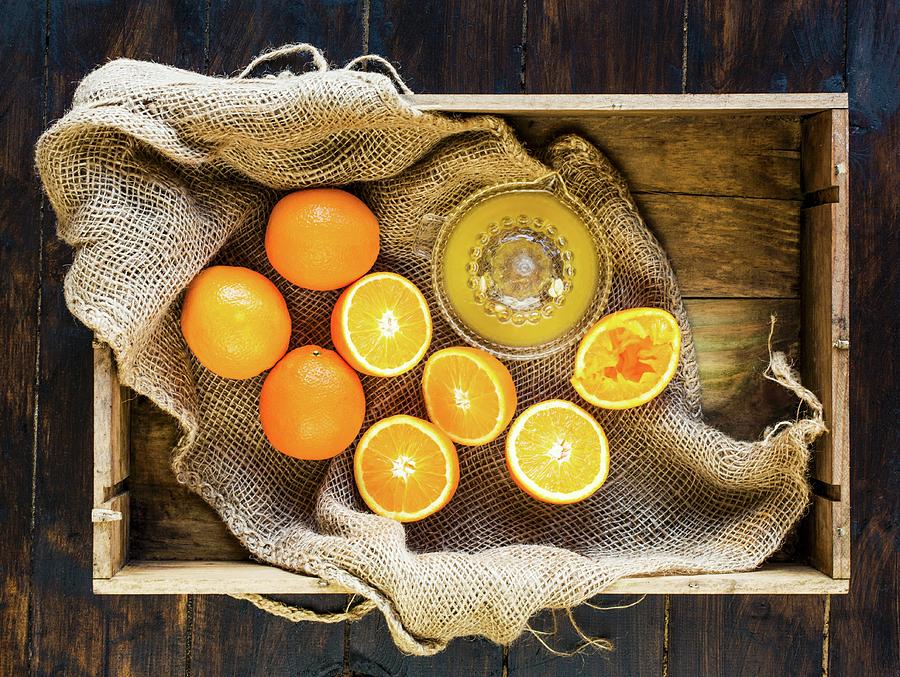 Box Of Fresh Oranges - Some Squeezed To Make Fresh Orange Juice ...