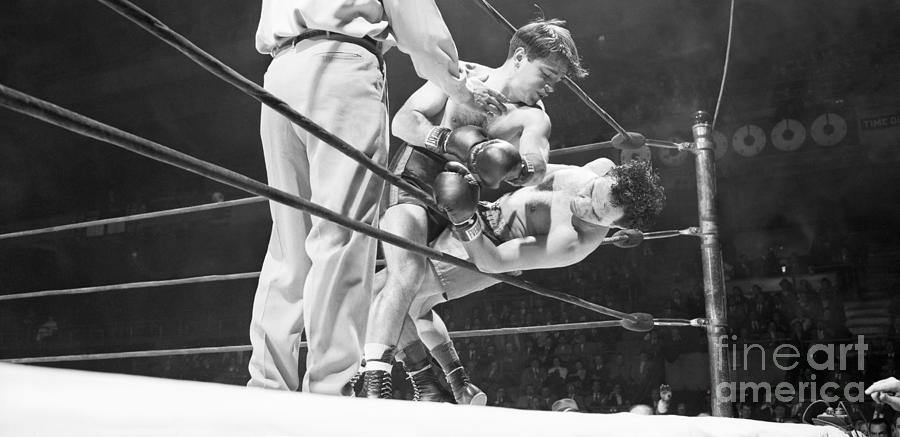 Boxer Against Ropes In Match Photograph by Bettmann