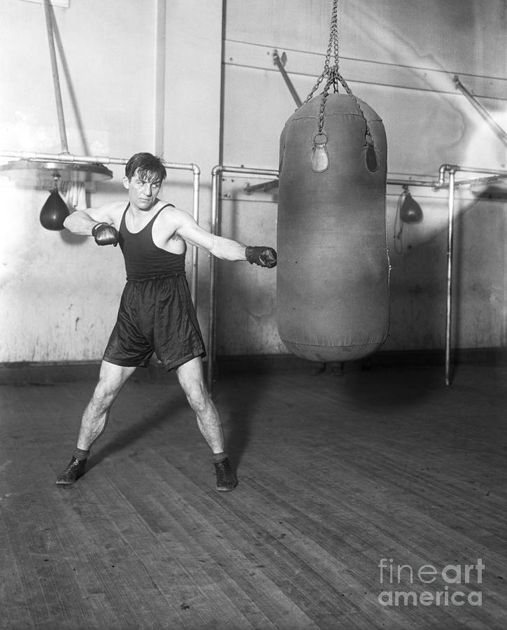 Boxer Georges Carpentier Working On Bag Photograph by Bettmann