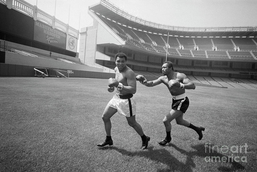 Boxer Ken Norton Chases Muhammad Ali Photograph by Bettmann