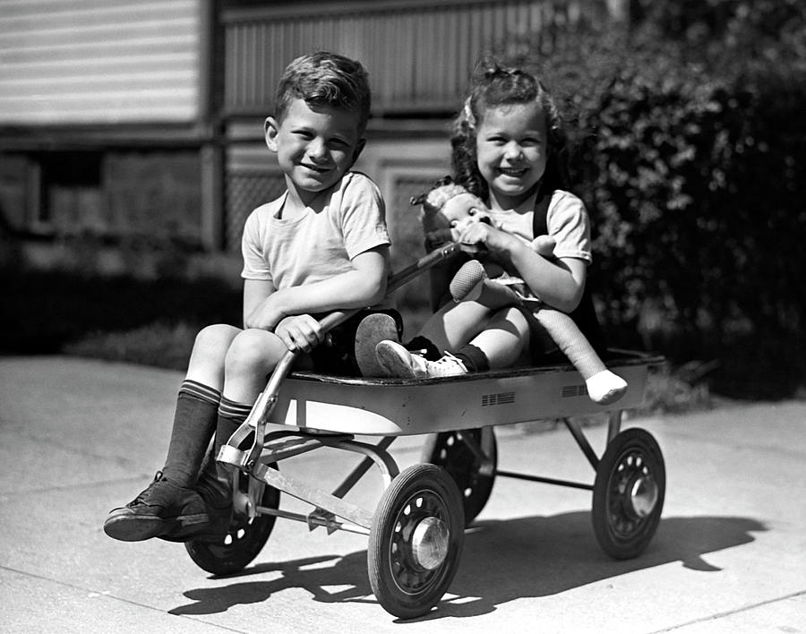 Boy & Girl On Wagon Photograph by George Marks
