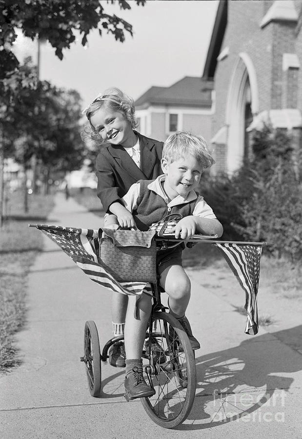 Boy And Girl 8-9 Years Riding Bicycle Photograph by Bettmann