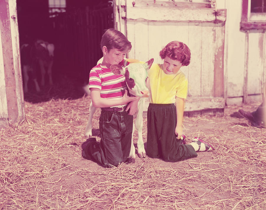 Boy And Girl Kneeling Straw In Barn Photograph by H. Armstrong Roberts