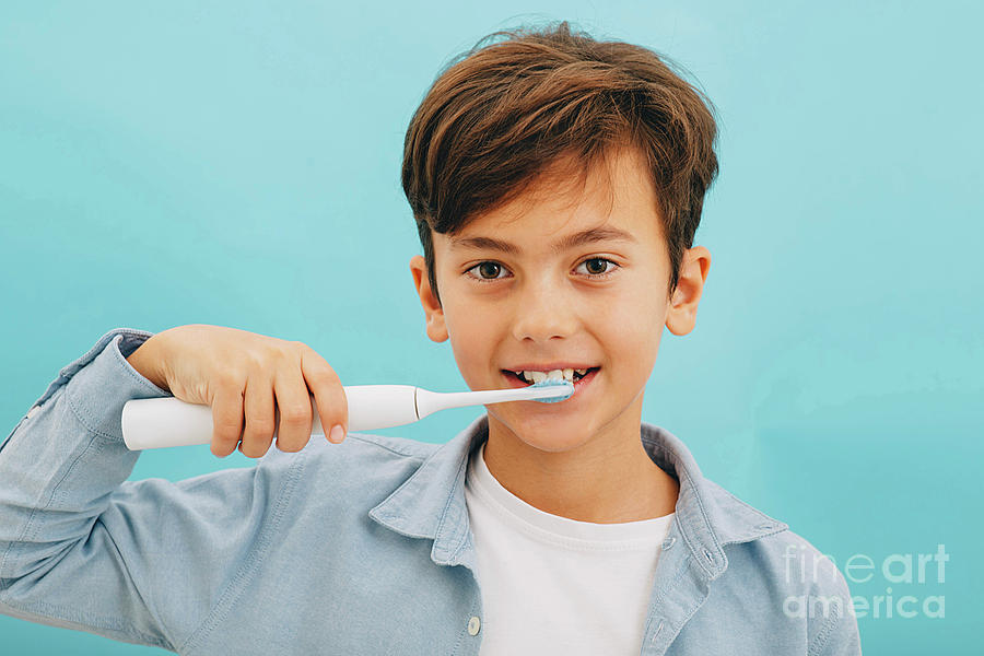 Boy Brushing His Teeth Photograph by Peakstock / Science Photo Library