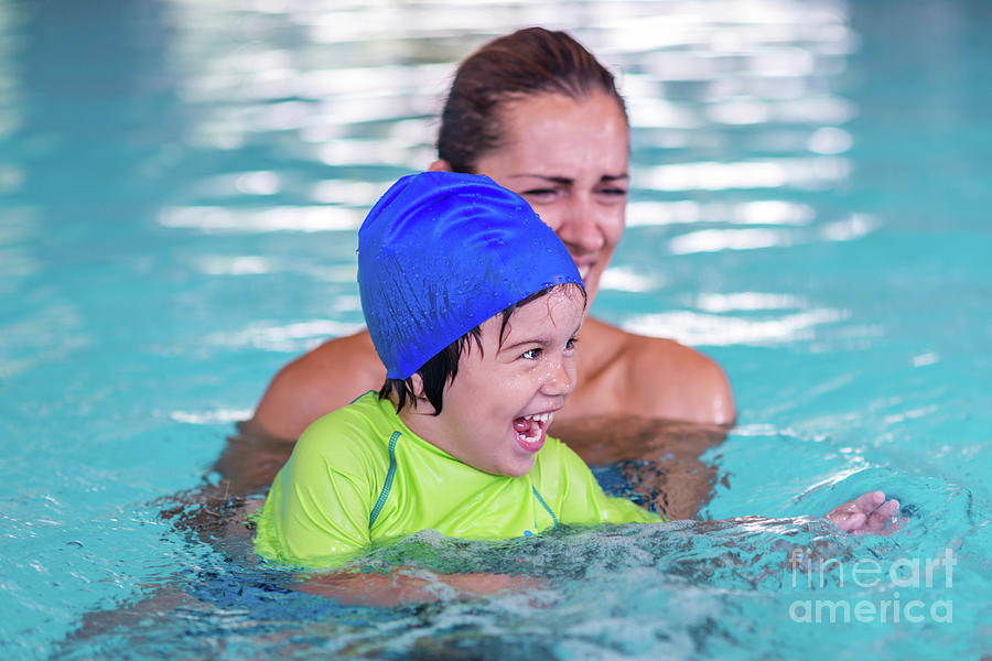 Boy In Swimming Pool With Mother Photograph by Microgen Images/science Photo Library