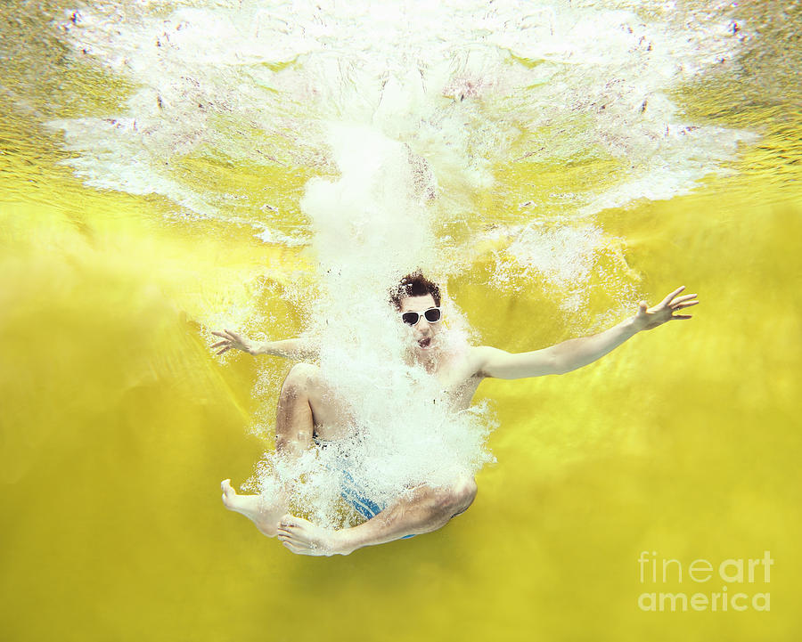 Boy Jumping Into Water On Yellow Photograph by Stanislaw Pytel