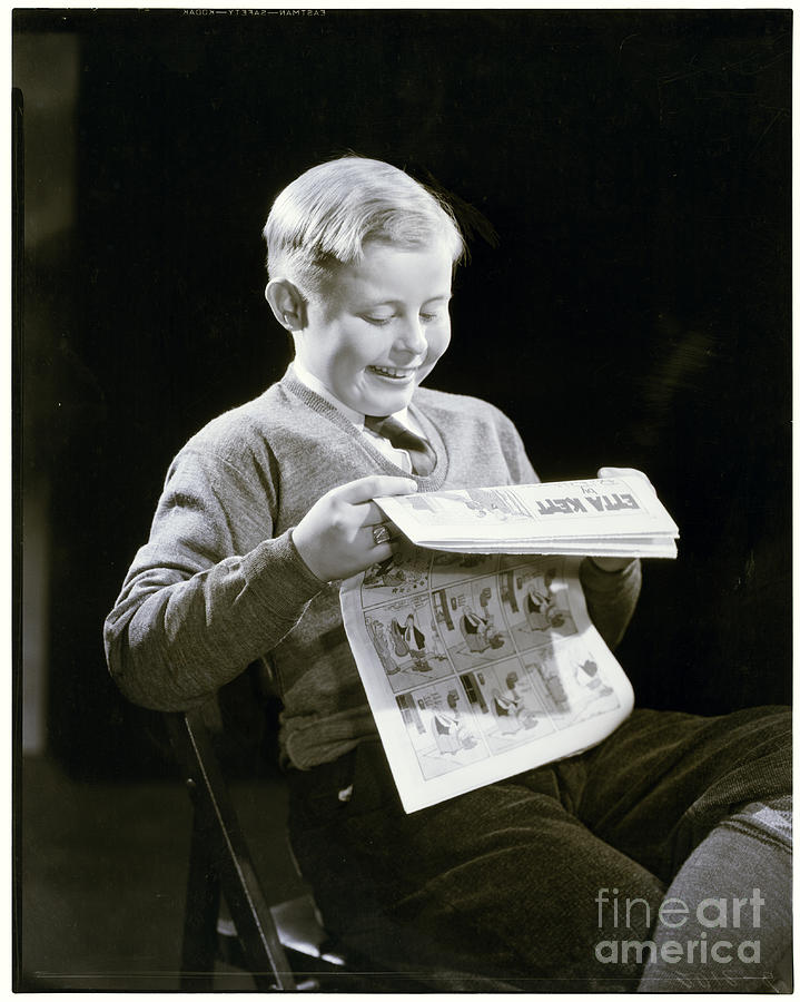 Boy Reading Comics Photograph by Bettmann