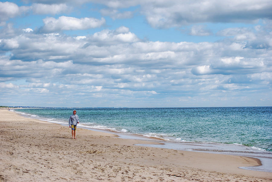 Boy walking on the beach in Rhode Island Photograph by Cordia Murphy